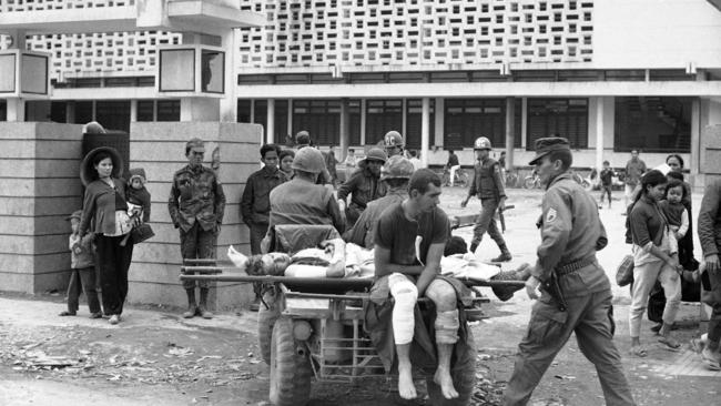 A motorised cart, called a mule, carries wounded US marines from battle areas to a first aid station near the University of Hue.