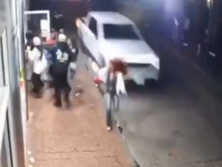 A camera on Bourbon Street in New Orleans, showing the F-150 driven by Shamsud-Din Jabbar as people jump out of its way before he continues running down other pedestrians celebrating the new year.