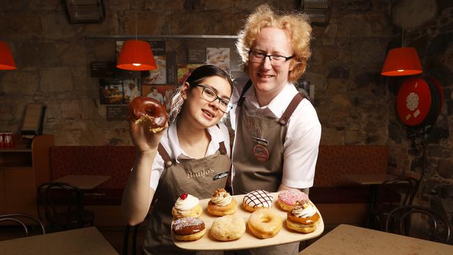 Porsha Gillott, Banjo’s senior staff member, and Colin Stack, shift supervisor, with the donuts. Banjo's Bakery Cafe has brought a sweet new addition in a range of gourmet donuts across all stores. Picture: Nikki Davis-Jones