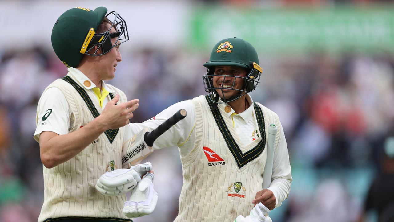 Marnus Labuschagne of Australia and Usman Khawaja of Australia walk from the ground.
