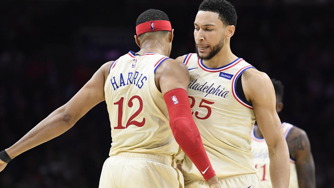 Tobias Harris chest-bumps Ben Simmons. Photo by Sarah Stier/Getty Images.