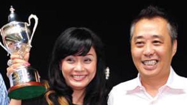 Dr Andy Wong and his sister Genni Wong at a racing event. Picture: Supplied 