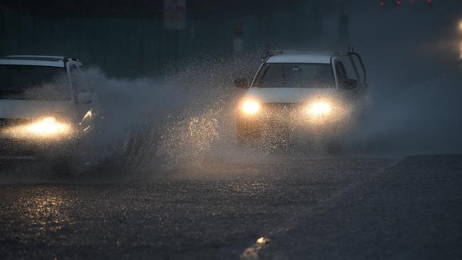 A car driving through heavy rainfall. Picture: AAP Image/Dan Himbrechts