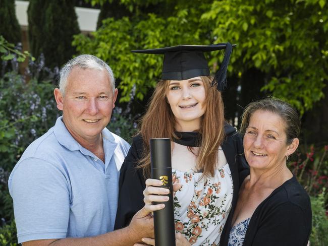 Bachelor of Nursing graduate Aleisha Thomson with parents Jason Murray and Jodie Scotney at a UniSQ graduation ceremony at Empire Theatres, Tuesday, October 31, 2023. Picture: Kevin Farmer