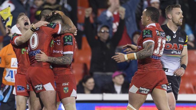 Matthew Dufty, Paul Vaughan and Gareth Widdop celebrate full time at Pepper Stadium.