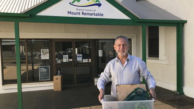 Former Mt Remarkable District Council chief executive Wayne Hart leaves the council's Melrose offices with his personal belongings. Picture: Supplied