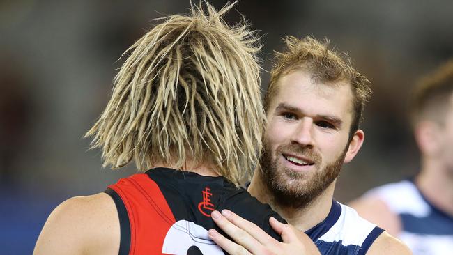 Geelong's Stuart Crameri shares a moment with Dyson Heppell after the game. Pic: Michael Klein