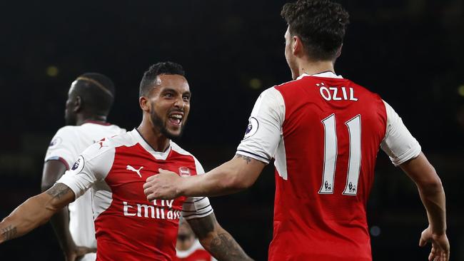 Arsenal's Theo Walcott celebrates with Mesut Ozil.