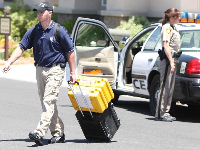 2009: Authorities leave the scene after executing a search warrant at the Red Rock Canyon Country Club residence of Dr. Conrad Murray, in Las Vegas. Picture: Daniel Gluskoter