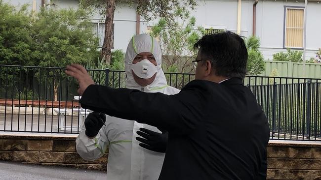 St Christopher's Catholic Primary School principal Jamie Wahab directs a cleaner at the Panania school on Tuesday. Picture: Lawrence Machado