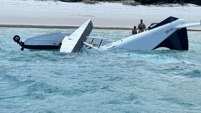 A Whitsunday Air Services plane crashed into waters off world-famous Whitehaven Beach with five people, a pilot and four passengers, on board. Picture supplied by Island FM Whitsundays