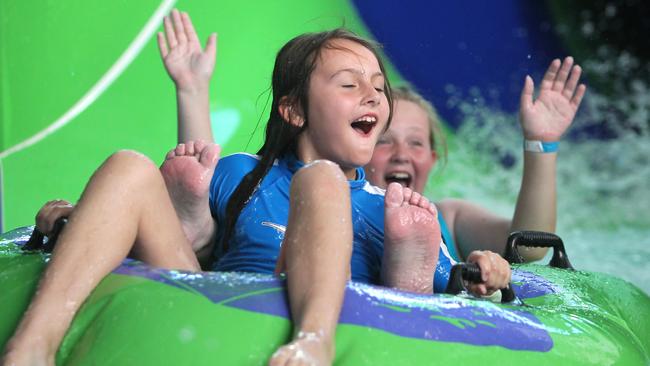 Ava, 8, and Teagan, 10, enjoy the water slide at Watermarc.