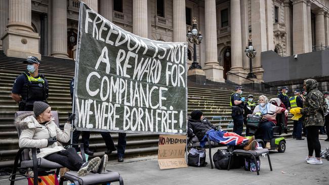 Protesters continuing their camp-out on the steps of Victorian parliament on Wednesday. Picture: Jake Nowakowski