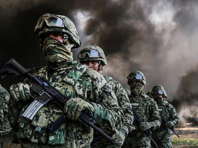 Members of Mexico's Marines destroy drugs in Acapulco, Guerrero during an operation last year. Picture: AAP 