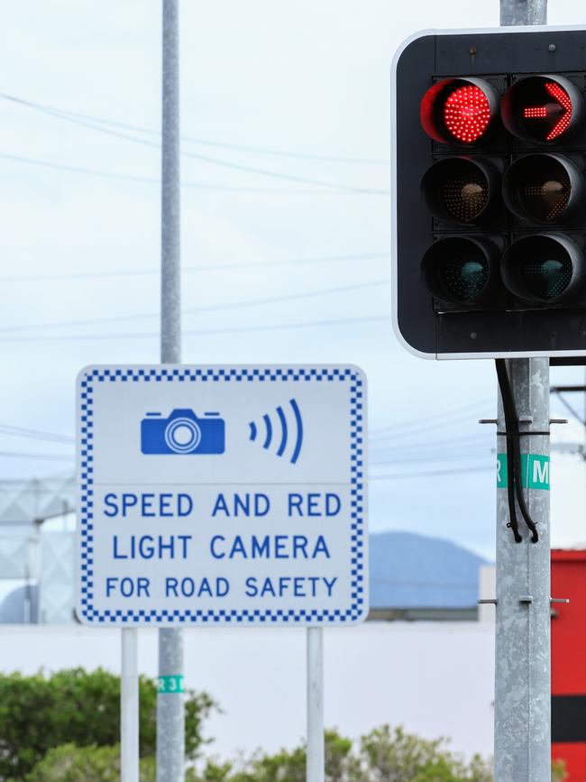 Traffic signs in QLD warning of an upcoming combined speed and red light camera. Picture: Brendan Radke