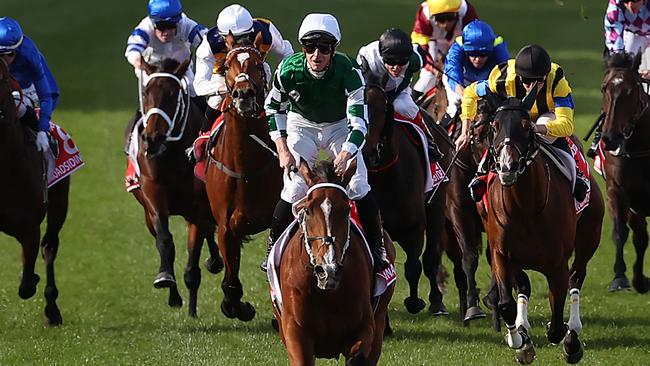 MELBOURNE, AUSTRALIA - OCTOBER 26: James McDonald riding Via Sistina (IRE) celebrates winning the Ladbrokes Cox Plate and his 100th Group 1 race during Cox Plate Day at Moonee Valley Racecourse on October 26, 2024 in Melbourne, Australia. (Photo by Kelly Defina/Getty Images)