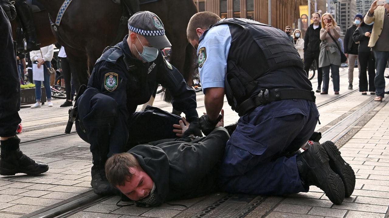 Protesters clash with NSW Police officers at Town Hall during a protest to rally for freedom of speech, movement, choice, assembly, and Health in Sydney. Picture: NCA NewsWire/Bianca De Marchi