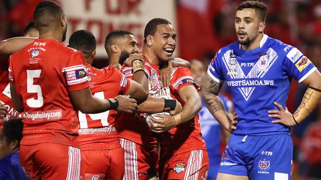 SYDNEY, AUSTRALIA — JUNE 23: William Hopoate of Tonga celebrates with teammates after scoring a try during the 2018 Pacific Test Invitational match between Tonga and Samoa at Campbelltown Sports Stadium on June 23, 2018 in Sydney, Australia. (Photo by Brendon Thorne/Getty Images)