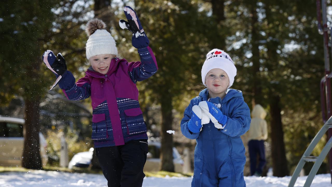 Amelia brother Patrick Deonck playing in snow in Bloome Park at Leura in the Blue Mountains. Picture: Jonathan Ng