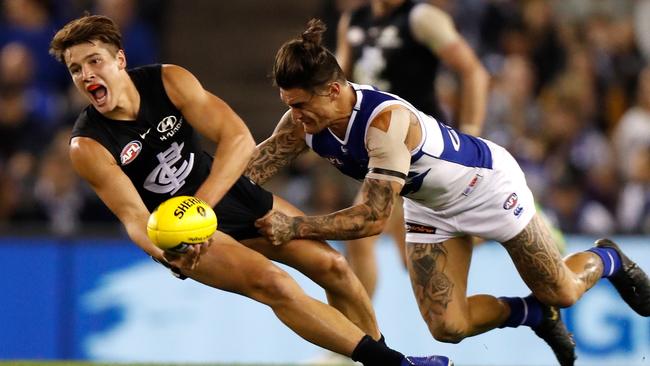 Carlton’s Liam Stocker gets a handball away during his debut against North Melbourne on Sunday. Picture: AFL Photos