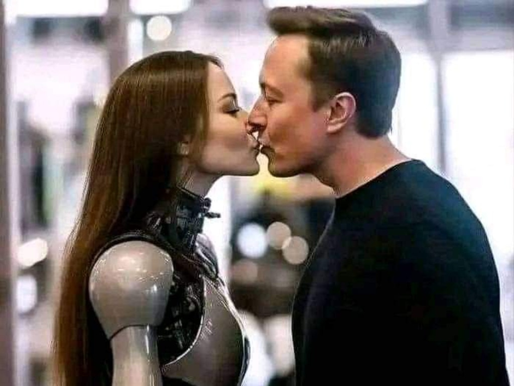 Photos of musk kissing humanoid robot women have gone viral. Picture: Twitter.