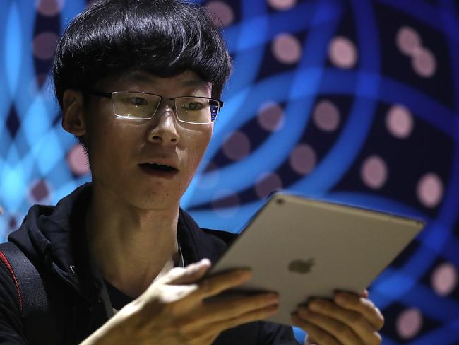 An attendee inspects the iPad Pro during the 2017 Apple Worldwide Developer Conference. Picture: Justin Sullivan