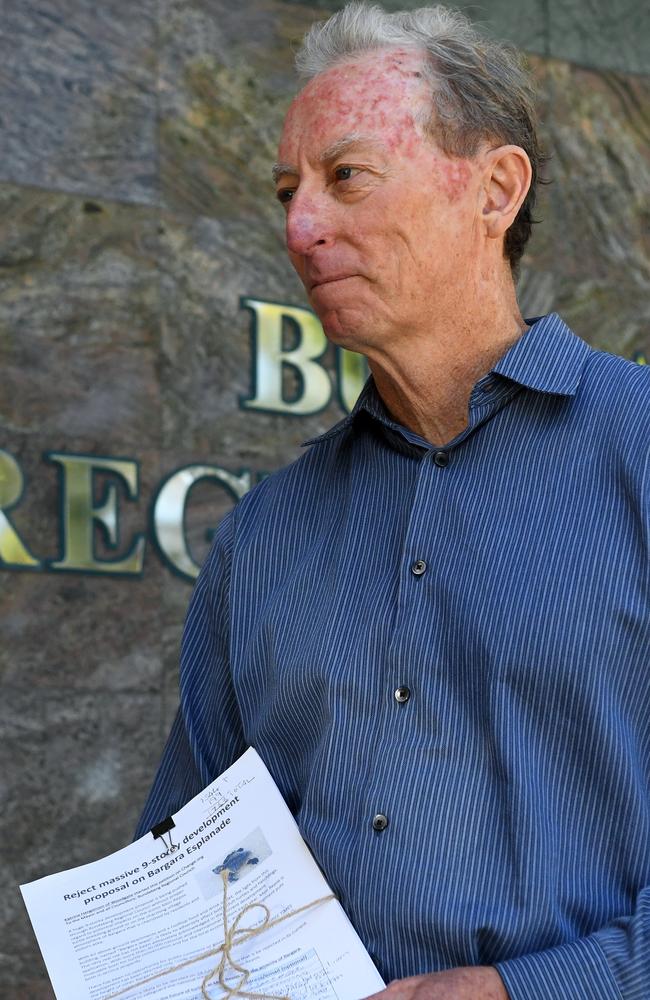 George Martin, who campaigned against nine-storey development, pictured in 2018 outside the Bundaberg Regional Council building with a petition signed by the community.