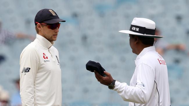 England captain Joe Root talks with umpire at the MCG today. Picture: Michael Klein