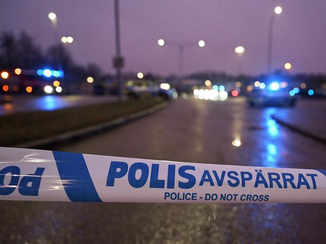 A Police cordon blocks the road leading to the scene of the Risbergska School in Orebro. Picture: AFP