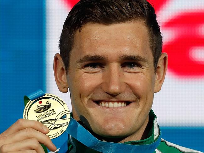 (FILES) In this file photo Cameron Van Der Burgh of South Africa celebrates a gold medal in the 50m Breaststroke on day six of the 13th FINA World Swimming Championships (25m) at the WFCU Centre on December 11, 2016 in Windsor Ontario, Canada. - Olympic champion swimmer Cameron van der Burgh said March 22, 2020 that he had contracted COVID-19, offering insight into how coronavirus infection could affect 2020 Olympic hopefuls. "I have been struggling with Covid-19 for 14 days today," South Africa's van der Burgh wrote on Twitter. "By far the worst virus I have ever endured despite being a healthy individual with strong lungs (no smoking/sport), living a healthy lifestyle and being young (least at risk demographic)." (Photo by Gregory Shamus / GETTY IMAGES NORTH AMERICA / AFP)