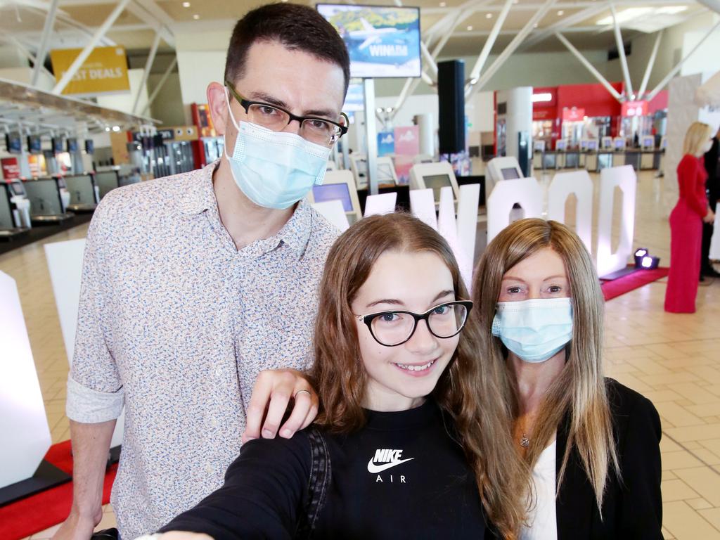 Gold Coast’s Meghan and David Rogers with daughter Saffy, 13, are some of the passengers on board the first Qantas flight from Brisbane to Los Angeles which resumed on Friday. Picture: Steve Pohlner