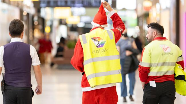 Virgin staff were dressed for the festive season at Adelaide Airport staff on December 25 – however, many flights were grounded. Picture: The Advertiser / Morgan Sette