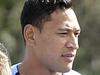 Wallaby Israel Folau coaching students after one, Thomas Finck, Year 10, won a competition run by a bread brand. Photo by Andrew Seymour.