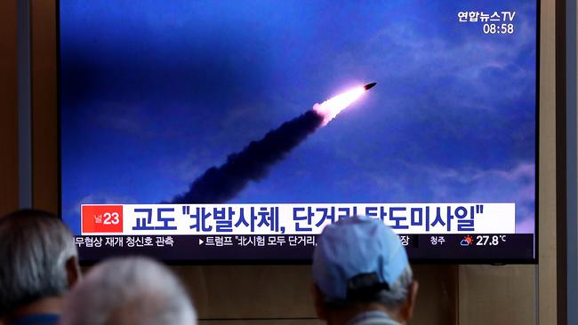 South Koreans watch a North Korean missile launch at the Seoul Railway Station. Picture: Getty Images.