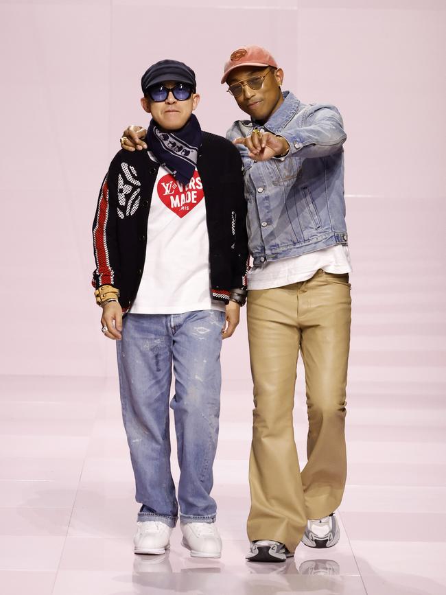 Pharrell Williams, right, on the runway for the finale of the Louis Vuitton men's fall/winter '25 show.