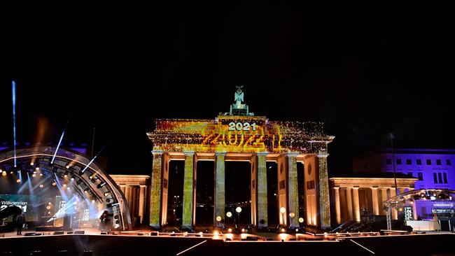 Berlin's landmark Brandenburg Gate is illuminated with the lettering '2021' at the start of a concert 'Willkommen 2021' (Welcome 2021) on New Year's Eve. Picture: AFP