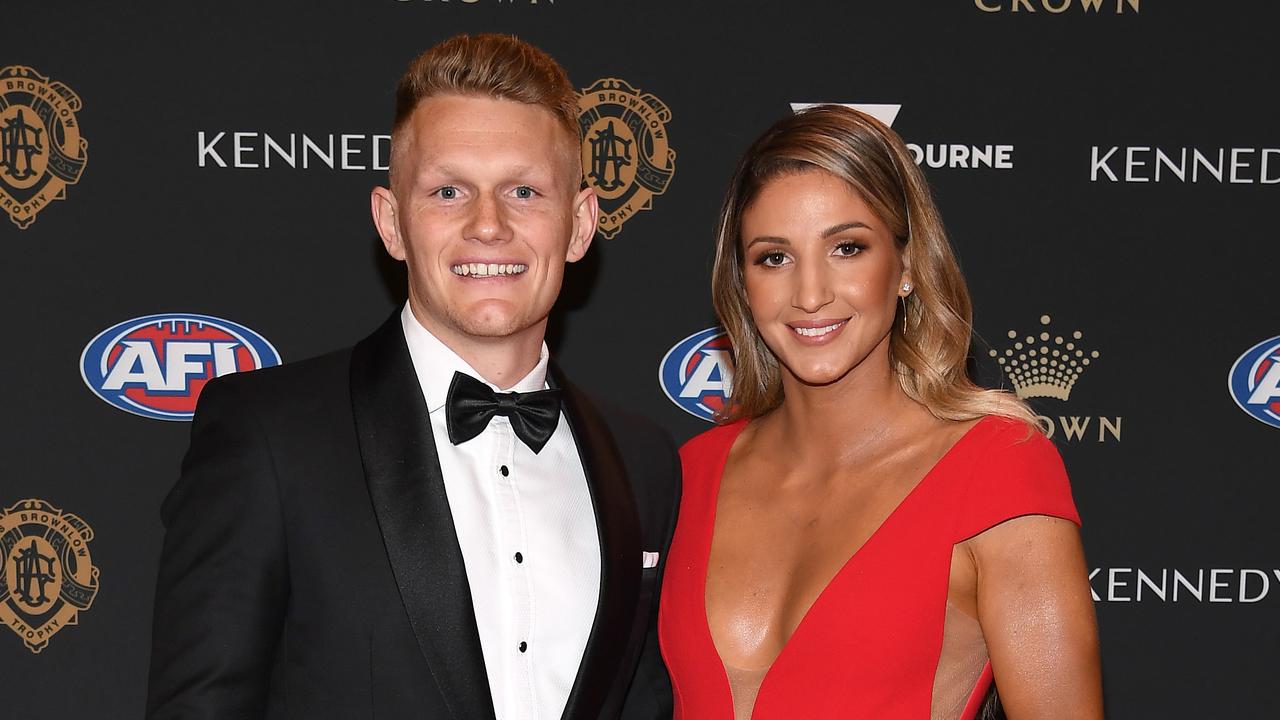 Adam Treloar of the Magpies and his partner Kim Ravaillion.