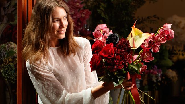 BLOOMING MARVELLOUS: Simone, of Adelaide, with flowers at Louise Woodhouse Flowers in Rundle Mall. Picture: MATT TURNER