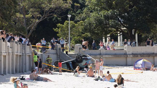 The beach was packed with sunbathers as the car flipped. Photo: Tim Pascoe