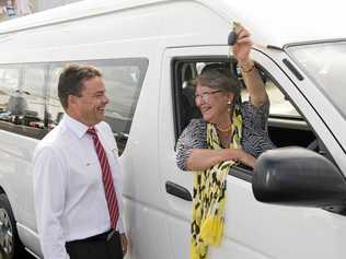 NEW PARTNERSHIP: Penny Hamilton is excited to be handed the keys to a new Toyota HiAce van from Brett Motton. Picture: Kevin Farmer