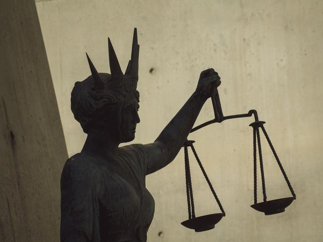 BRISBANE , AUSTRALIA - NewsWire Photos - BRISBANE , JUNE 24 2024: Generic photo of the scales of justice stature outside Brisbane Supreme Court in the Brisbane CBD. Picture: NewsWire / Glenn Campbell