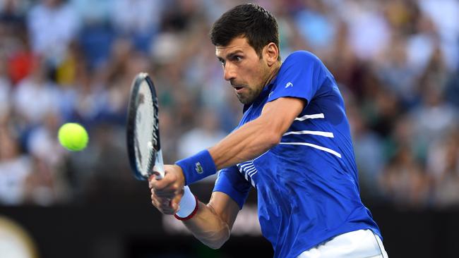 Novak Djokovic of Serbia in action against Kei Nishikori of Japan during the men's singles quarter final match. Picture: AAP