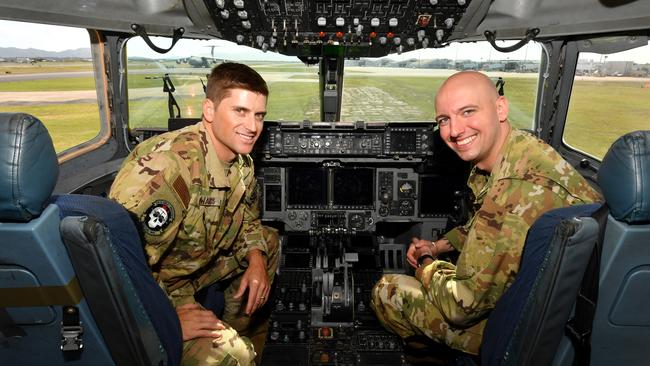 Exercise Mobility Guardian. USAF pilots Major Justin Edwards and Captain Stefan Curcic with Moose, the C-17 Globemaster they pilot, at RAAF Base Townsville. Picture: Evan Morgan