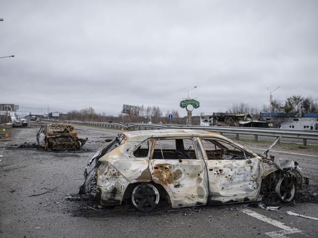 MYLA, UKRAINE - APRIL 02: A burnt car is seen on the road between Myla and Mriia, on April 2, 2022 near Myla, Kyiv region, Ukraine. After 5 weeks of war, Russian forces around the capital have been pushed back in some places by Ukrainian counter-attacks. But shelling persists in suburbs of Kyiv, which, like much of the country, remains vulnerable to Russian air strikes. (Photo by Alexey Furman/Getty Images)