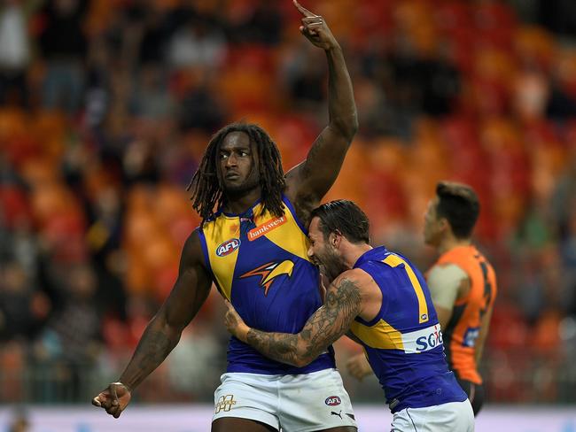 Chris Masten hugs Nic Naitanui after the ruckman kicked the matchwinning goal. Picture: Getty Images