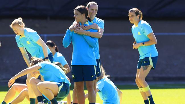 Sam Kerr is held by Emily van Egmond at Matildas training in Brisbane on Friday. Picture: Adam Head