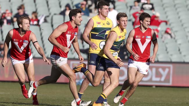 North Adelaide’s Aidan Tropiano, second from left, at the start of the final quarter of Sunday’s preliminary final. Picture: Sarah Reed