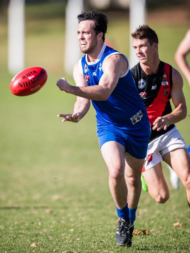 St Peter's Jack Johnson sending off a handball in the match against Tea Tree Gully at Caterer Oval. Picture: MATT LOXTON