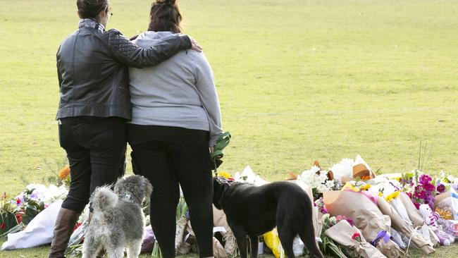 Members of the public leave tributes to Eurydice Dixon in Princes Park in Melbourne, where her body was discovered on Wednesday morning. (Pic: Matrix News)