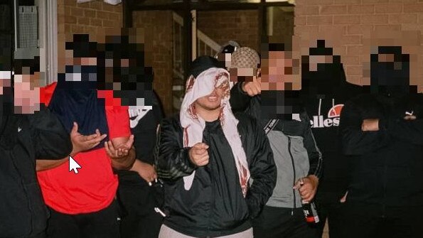 OneFour rapper Salec Sua, 27, is known to keep his face covered. Pictured here with other OneFour rap group members. Picture: Supplied